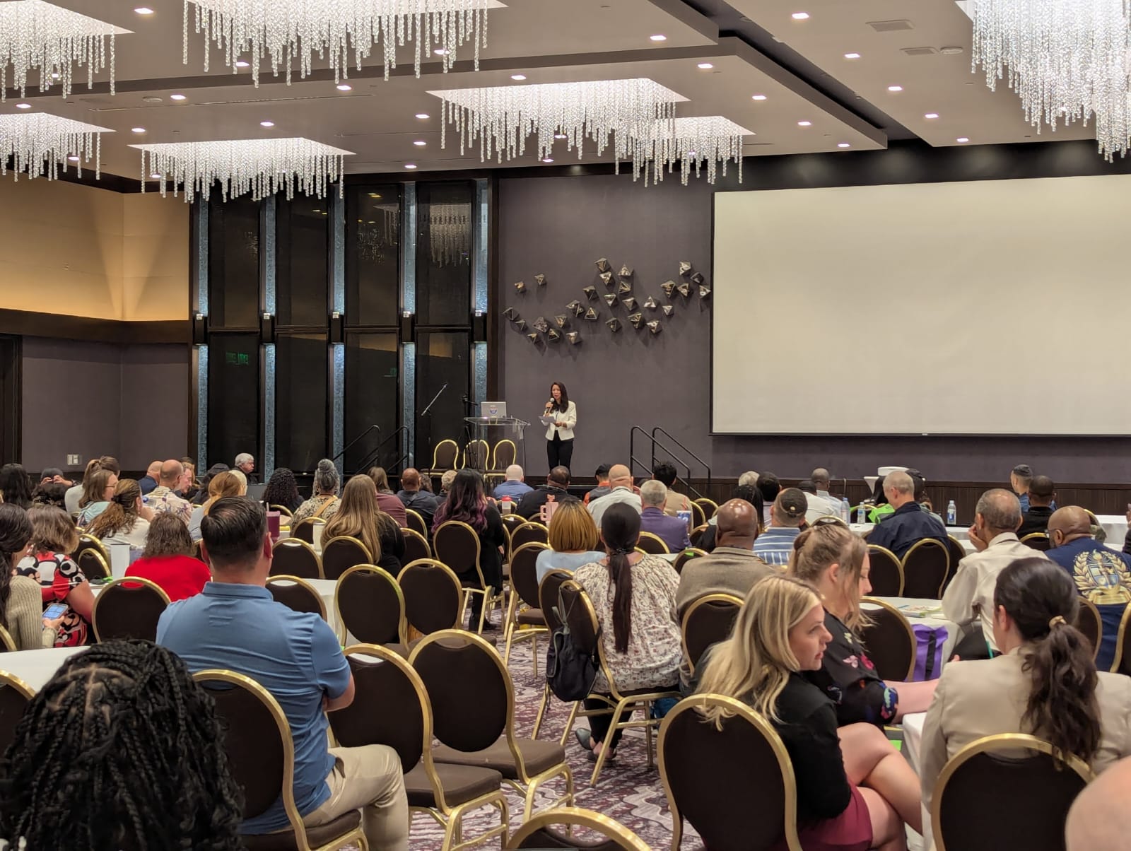 Thao Tran speaking to a conference audience