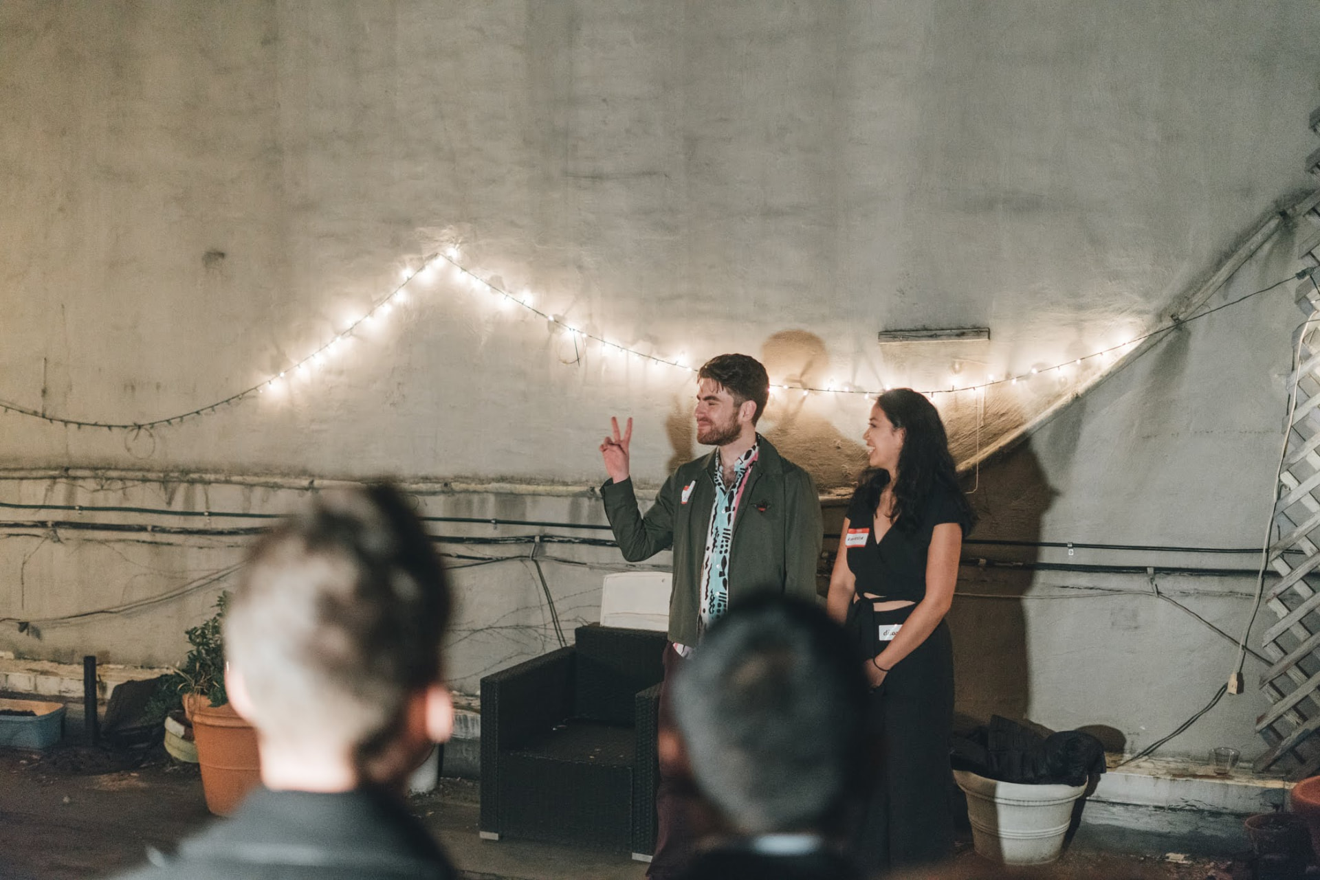 Thao Tran at an intimate speaking event with fairy lights